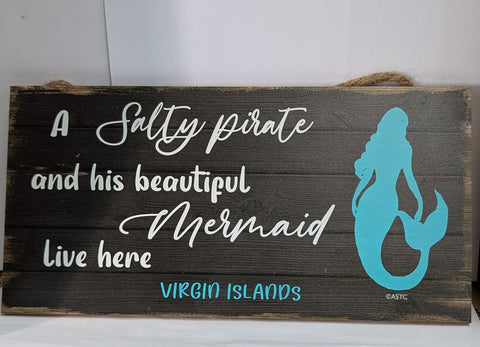A Salty Pirate and his beautiful Mermaid live here